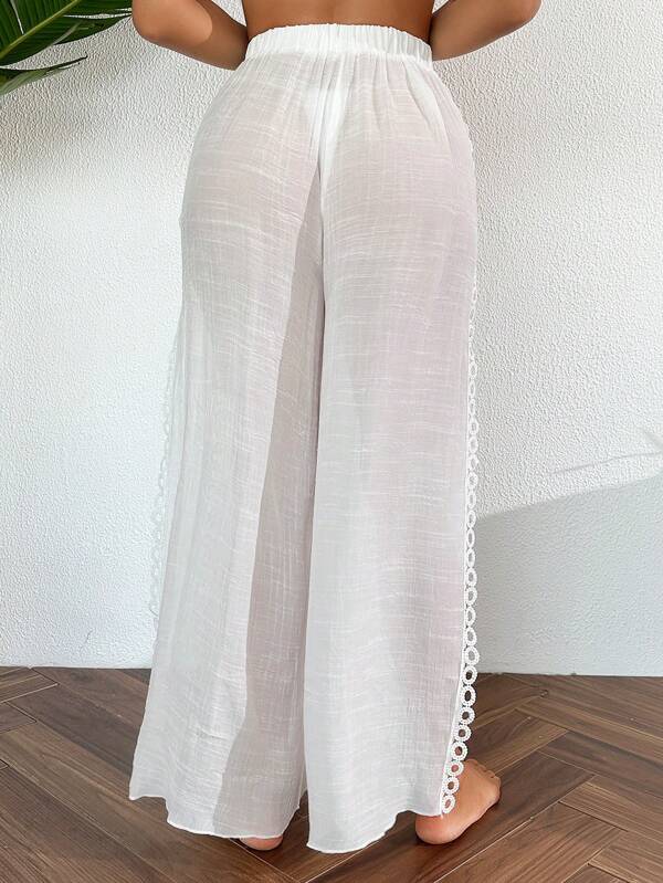 Saída De Praia Calça Fluida Com Fenda Bordada